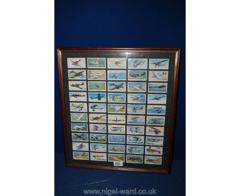 A framed set of Cigarette cards of vintage aircraft, issued in 1938.