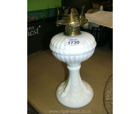 A white moulded glass Oil Lamp