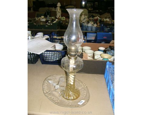 A small quantity of glass including oil lamp, bird ornament and oval fruit plate.
