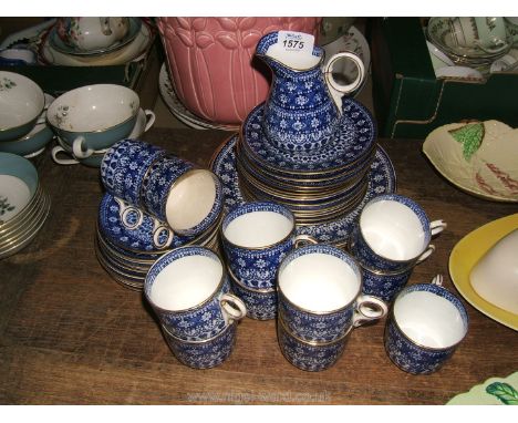 A pretty vintage Blue and White bone china part Teaset including eleven ring-handled cups, eleven saucers, milk jug, thirteen