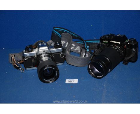 An Olympus 0040 Camera and lens together with a Practica BC Camera and lens