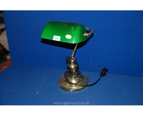 A Banker's Lamp with brass coloured base and green glass shade, 14 1/2" tall