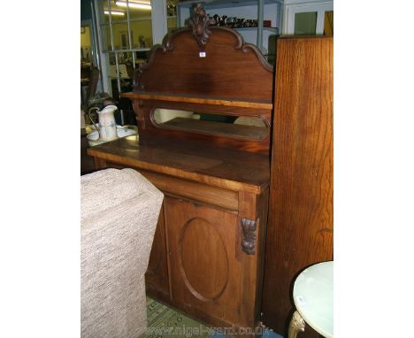 A Victorian Mahogany Chiffonier with upstand back having stylised Acanthus carved central motif over shaped back panel with s