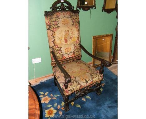 A late 19th c. Oak, 18th style Baronial Elbow Chair having carved and pierced top rail, elegant long swept arms with flower a