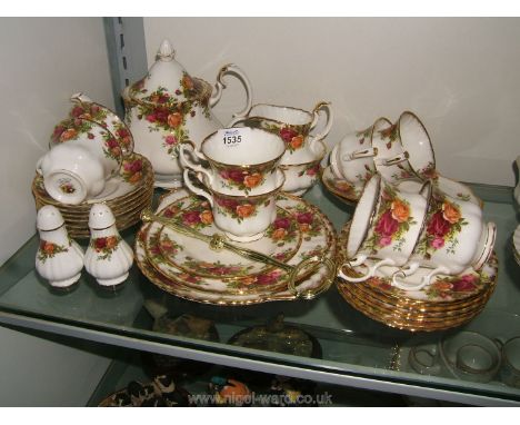 A Royal Albert 'Old Country Roses' Tea Service including teapot, eight cups, seven saucers, milk jug, sugar bowl, salt and pe