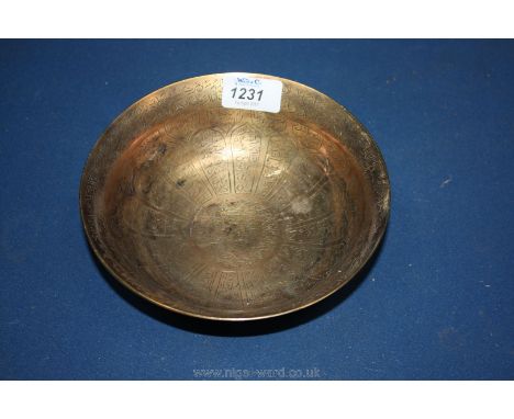 An Ottoman brass hammam 'magic' bowl engraved with letters and symbols, 19th century.