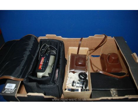 A box of various Cameras, a vintage Lens, Video camera and Cine Camera