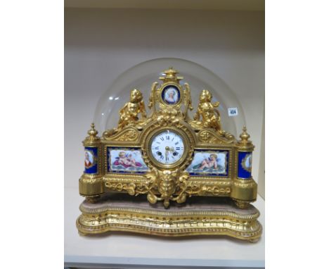 An impressive French ormulu mantle clock with porcelain plaques and enamel dial signed LENOIR A PARIS, with a gilt wood base 