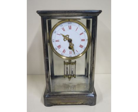 A four glass mantle clock with mercury pendulum, 30cm tall, 18cm wide, not running, glass chipped to front and back 