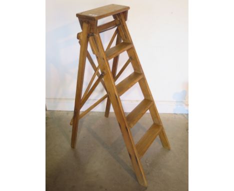 A vintage four tread step ladder, stripped and waxed for decorative use 