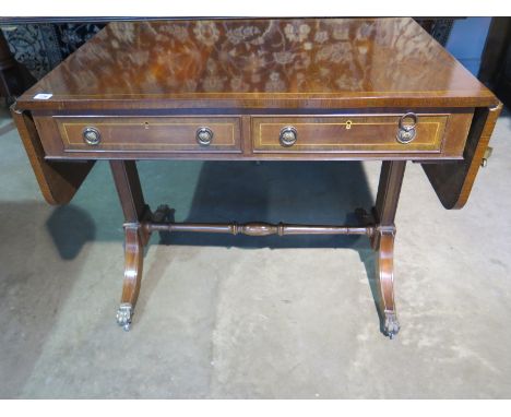 A Georgian style mahogany two drawer drop leaf sofa table, 74cm H x 61cm x 148cm extended 