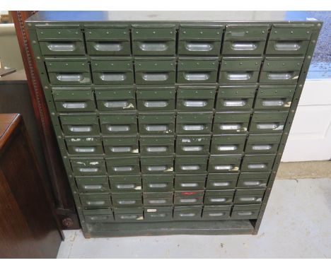 A vintage green metal filing cabinet with 54 drawers, approx 107.5cm H x 89cm W x 29cm D, condition commensurate with age