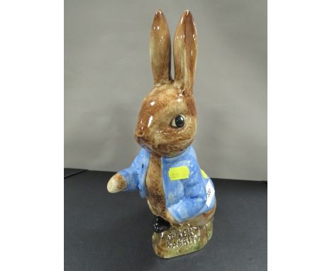 A large pottery figure of Peter Rabbit with replica stamp to base, we do not believe this figure to be Sylvac