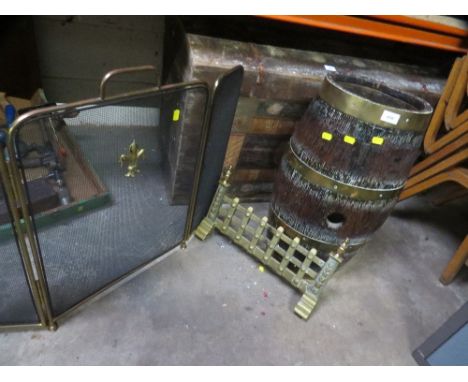 A brass and oak coopered barrel stick stand, together with a brass fire grate and fireguard