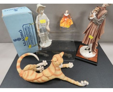 Four ceramic figures to include a boxed Lladro figure of a fishing girl 