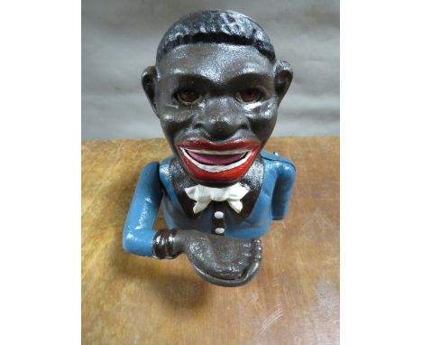 **A smiling Sam money bank** Notice from the the-saleroom.com: These items are listed on the basis they are illustrative of a
