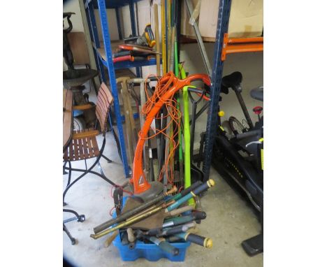 A large selection of garden tools to include saws 