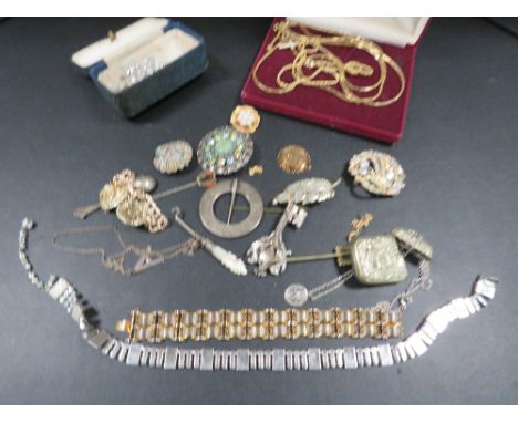 An assortment of vintage costume jewellery and collectables to include a vesta case, button hook etc