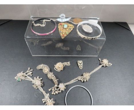 A quantity of silver and white metal jewellery to include enamel bangles 