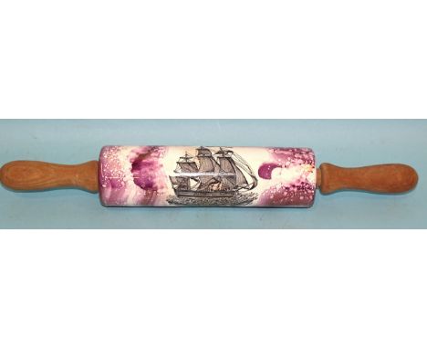 A ceramic rolling pin with "Ship Sally" and puce lustre glaze, 45cm long. 
