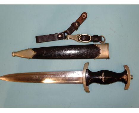 A WWII German Third Reich personalised S.A. marine dagger with black finish to grip, eagle, swastika and enamel SA device, et