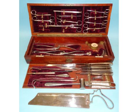Henry Lewis, London, a surgical instrument set, including amputation saws, trepanning bits, catheters, clamps, etc, by Evans 