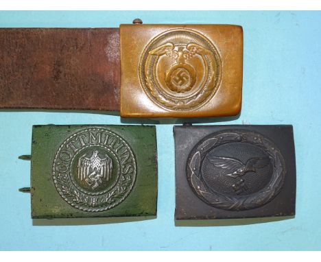 A German WWII leather belt with SA belt buckle, a German army belt buckle stamped J.F.S. and a Luftwaffe belt buckle, (3). 