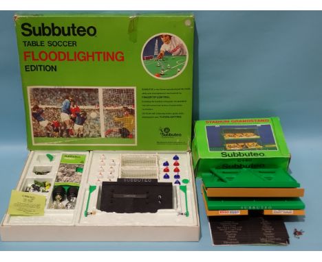 Subbuteo, a boxed Subbuteo floodlighting set, (not complete) and a boxed C140 Stadium Grandstand, (2). 