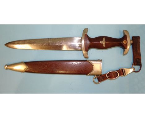 A WWII German S.A. M33 dagger, the double-edged blade marked Gebr. Becker, Solingen trademark, brown wood grip marked WF to c