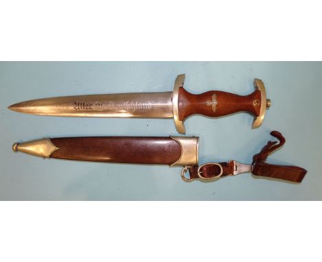 A WWII German Ground Rohm SA dagger with brown wooden grip with metal eagle, swastika and enamel SA device, the cross guard s