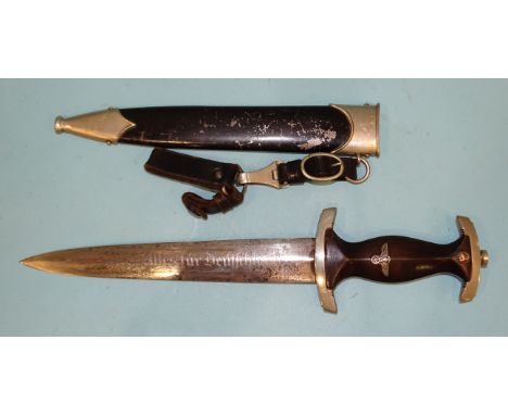 A WWII German Third Reich SA marine dagger with brown wooden grip with metal eagle, swastika and enamel SA device, cross guar