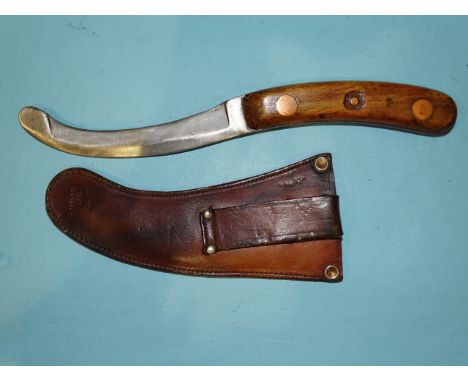 A WWII paratrooper's parachute escape knife in leather scabbard, the 14cm blade with broad arrow and RAF, ref: ZIF/1206198, m