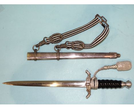 A WWII Third Reich German railway (bahnschutz) official's dagger, the black celluloid grip with ball-top pommel and swastika,