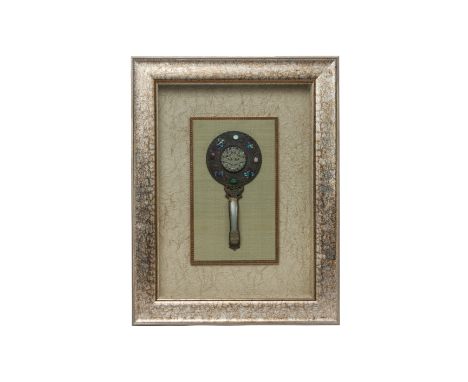 A CARVED JADE INSET MIRROR
The central carved jade within a surround of auspicious symbols in relief and hardstone insets, th