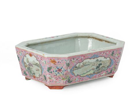A PINK GROUND FAMILLE ROSE PORCELAIN PLANTER Rectangular with cut corners, the sides and ends decorated with shaped reserves 