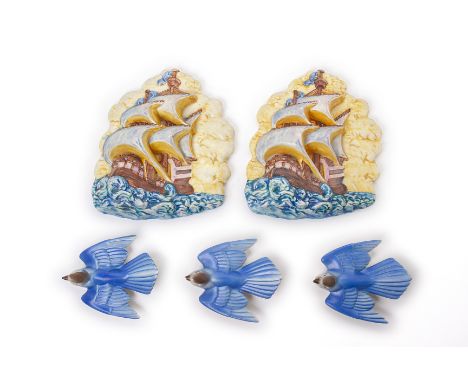 A PAIR OF BESWICK 'GALLEON' WALL PLAQUES
Modelled in relief as a galleon in full sail, together with three Poole pottery blue
