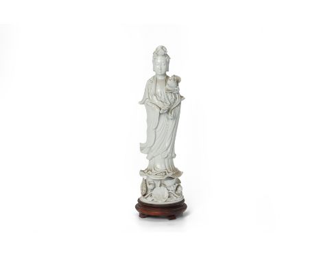 A LARGE BLANC DE CHINE MODEL OF GUANYIN
Late 20th century
Modelled standing on a lotus decorated base
62cm high
Condition: Fo