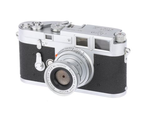 A Leica M3 Rangefinder Camera, 1955, chrome, serial no. 733485, with Leitz Elmar f/2.8 50mm lens, 1958, chrome, serial no. 16