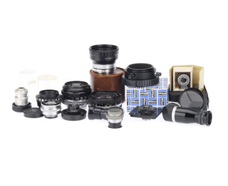 A Mixed Selection of Lenses including a Nikon Series E 50mm camera lens, a Nikon EL-Nikkor f/5.6 135mm, a Rodenstock Rodagon 