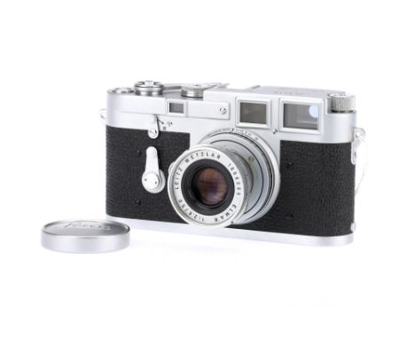 A Leica M3 Rangefinder Camera, 1955, chrome, serial no. 754104, with Leitz Elmar f/2.8 50mm lens, chrome, serial no. 1668099,