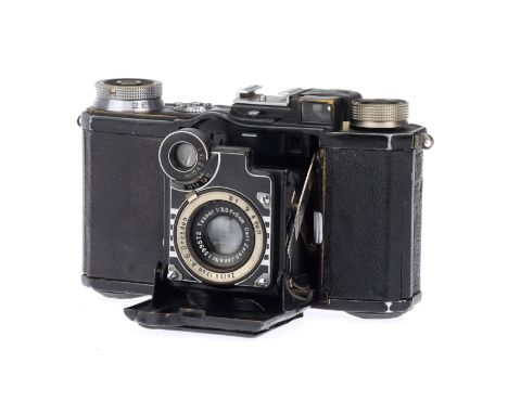 A Zeiss Ikon Super Nettel 35mm Rangefinder Camera, black, body G, shutter working, speeds sound reasonable, with Carl Zeiss J