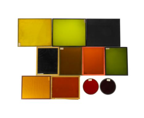 A Collection of Darkroom Safelight Glass Filters comprising 1) a total blackout glass, 2) a Wratten Series OA green side, yel