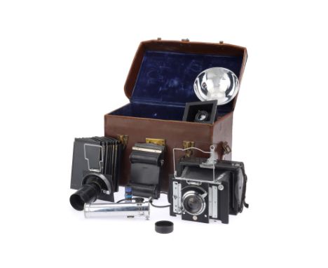 A Van Neck Pressmaster Folding Strut Camera Outfit, body G-VG, shutter appears to be working at time of auction, missing grou