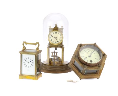 Collection of 3 Clocks Comprising of a brass Carriage clock the white enamelled face marked Vokes Bath made in Paris, a repro