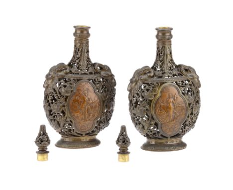 Pair of Late Victorian Aesthetics Bronze Candlesticks, of pierced flask form with male and female figural copper plaques eith