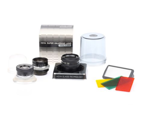 A Selection of Three Enlarger Lenses, to include a Wray Supar f/4.5 4¼" lens, optics G-VG, some dust present, together with a