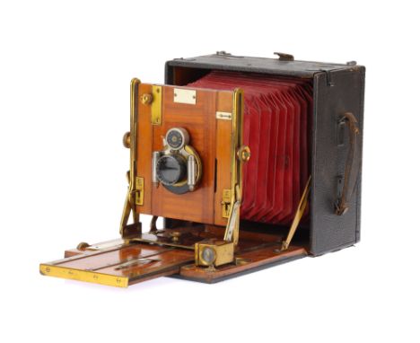 A Junior Sanderson Hand &amp; Stand Mahogany &amp; Brass Camera, half plate, body G, some signs of wear, bellows G, with Seri