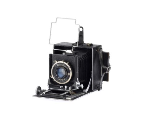 A Soho Ltd. Precision Medium Format Folding Camera, black, body VG, bellows aged but G, with a Carl Zeiss Jena Tessar f/4.5 1