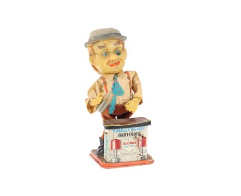 A Charlie Weaver Bartender Tin Toy, in G condition, some light bleaching to all parts, untested with batteries,