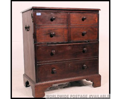 A 19th century Georgian mahogany commode / bachelors chest of drawers. Raised on bracket feet with faux chest of drawers fron